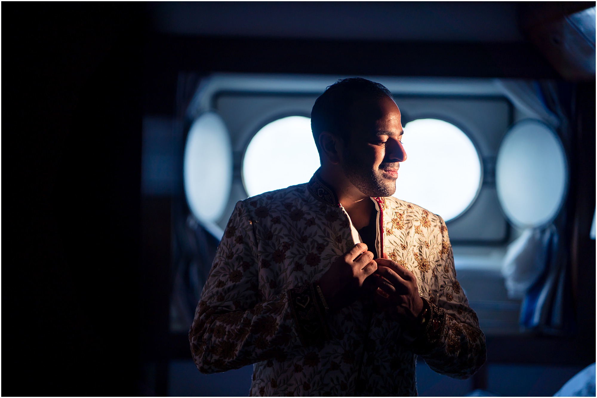 indian groom getting ready on the boat