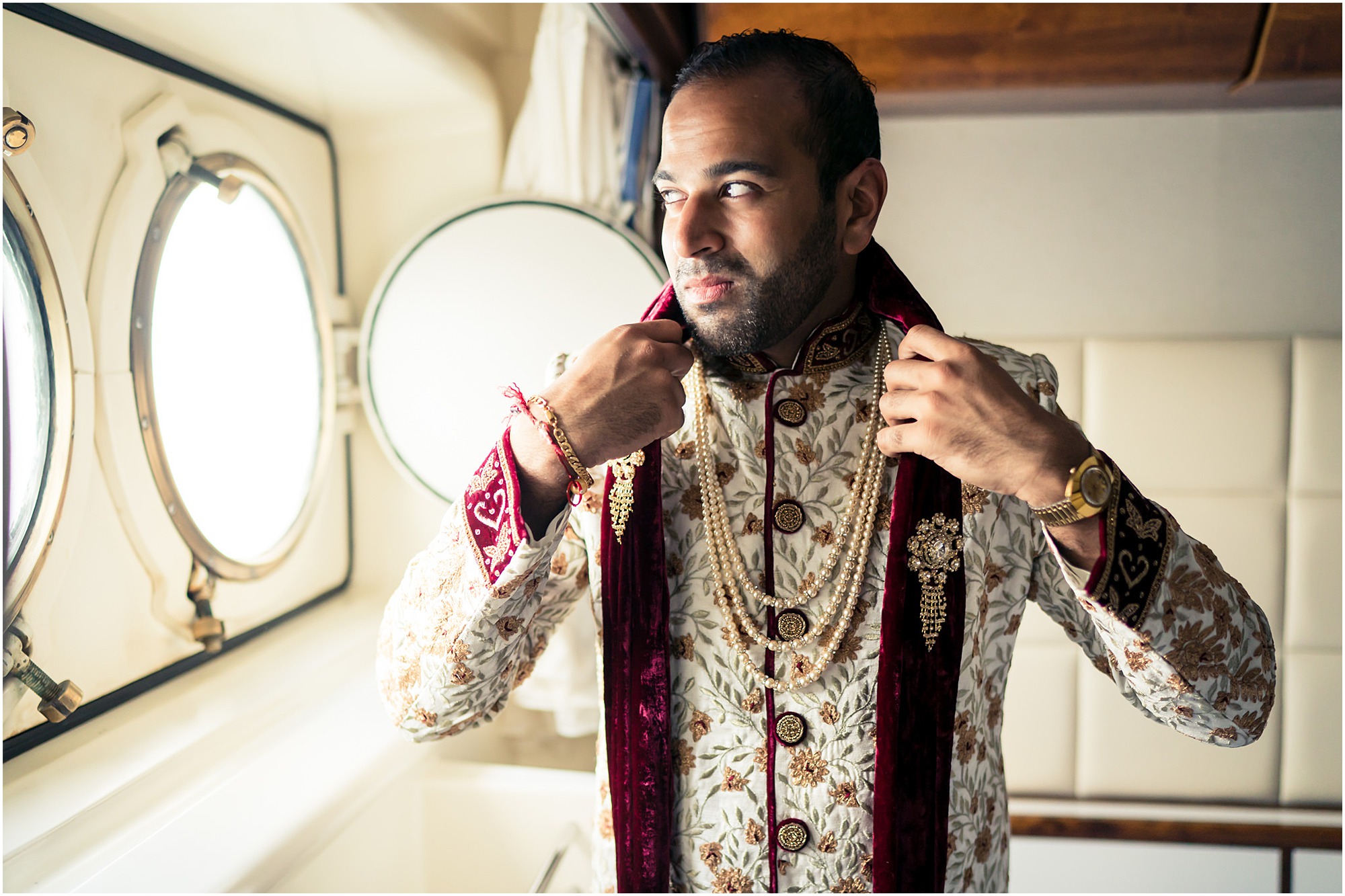 indian groom getting ready on the boat