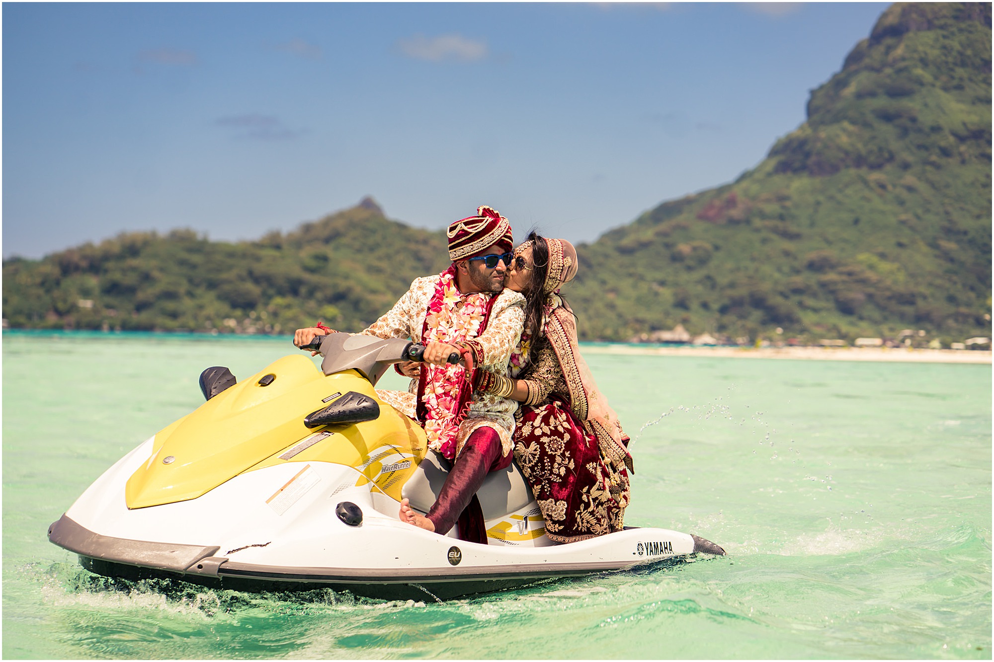 bora bora motu tapu bride and groom riding away in jetski